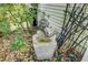 Outdoor backyard water feature with stone pots and lush plants at 9447 Harroway Rd, Summerville, SC 29485