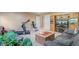 Finished basement with comfortable seating, a TV, and exercise equipment at 9447 Harroway Rd, Summerville, SC 29485