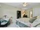 Bedroom featuring floral bedding, a window, and a table with chairs at 9447 Harroway Rd, Summerville, SC 29485