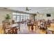 A lovely dining room is filled with tables and natural light from the windows at 9447 Harroway Rd, Summerville, SC 29485