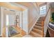 Spacious foyer with hardwood floors, staircase, and natural light at 9447 Harroway Rd, Summerville, SC 29485