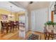 Elegant foyer view into dining room with a hardwood floor, natural light, and neutral tones at 9447 Harroway Rd, Summerville, SC 29485