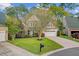 Inviting two-story home with a manicured lawn and mature trees at 9447 Harroway Rd, Summerville, SC 29485