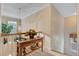 Upstairs hallway featuring a wooden console table with sunflowers and candle decor at 9447 Harroway Rd, Summerville, SC 29485