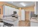 Bright kitchen featuring white cabinets, stainless steel appliances, and granite countertops at 9447 Harroway Rd, Summerville, SC 29485
