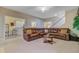 Spacious living room featuring a comfortable sectional sofa and views into the kitchen area at 9447 Harroway Rd, Summerville, SC 29485