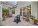Outdoor patio with pergola, comfortable seating, and manicured landscaping at 9447 Harroway Rd, Summerville, SC 29485