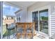 The back porch has an outside bar with stools and sliding glass doors at 9703 Mosgrove Ave, Ladson, SC 29456