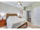 Bright bedroom with ceiling fan, wood furnishings, and neutral walls with an ensuite bath at 9703 Mosgrove Ave, Ladson, SC 29456