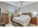 Comfortable bedroom with ceiling fan, dresser, nightstand and window with natural light at 9703 Mosgrove Ave, Ladson, SC 29456
