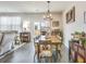 Elegant dining area featuring a wooden table, stylish chairs, and sliding glass doors at 9703 Mosgrove Ave, Ladson, SC 29456