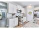 Bright kitchen with white cabinets, granite countertops, stainless steel appliances, and gas range at 9703 Mosgrove Ave, Ladson, SC 29456