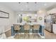 Spacious kitchen island with granite countertop, pendant lighting, and bar seating at 9703 Mosgrove Ave, Ladson, SC 29456