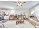 Comfortable living room with hardwood floors, modern decor, and an open view to the kitchen at 9703 Mosgrove Ave, Ladson, SC 29456