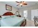 Spacious main bedroom with decorative headboard and attached ensuite with a soaking tub at 9703 Mosgrove Ave, Ladson, SC 29456