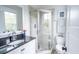 Bright bathroom with corner shower, granite countertop, and neutral tile at 975 Warrick Oaks Ln, Mount Pleasant, SC 29464