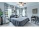 Comfortable bedroom with a soft color palette, a ceiling fan, and large windows at 975 Warrick Oaks Ln, Mount Pleasant, SC 29464