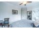 Simple bedroom with neutral colors, large mirror, and plenty of natural light at 975 Warrick Oaks Ln, Mount Pleasant, SC 29464