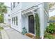 Inviting entryway featuring a dark front door, neatly landscaped greenery, and stylish decor at 975 Warrick Oaks Ln, Mount Pleasant, SC 29464