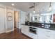 Spacious kitchen with granite counters, white cabinets, and an open view into the living area at 975 Warrick Oaks Ln, Mount Pleasant, SC 29464