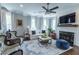 Cozy living room featuring a fireplace, comfortable seating, and ample natural light at 975 Warrick Oaks Ln, Mount Pleasant, SC 29464