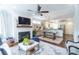 Open-concept living space features fireplace, dining area and modern kitchen, creating a comfortable and inviting home at 975 Warrick Oaks Ln, Mount Pleasant, SC 29464