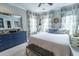 Bright main bedroom featuring neutral paint, patterned drapes, and comfortable seating area at 975 Warrick Oaks Ln, Mount Pleasant, SC 29464