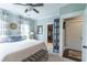 Comfortable bedroom featuring a large bed, ceiling fan, and access to a walk-in closet at 975 Warrick Oaks Ln, Mount Pleasant, SC 29464