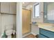 Well-lit bathroom featuring a shower, cabinet, and sink at 1 Battery Park Rd, Edisto Island, SC 29438
