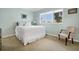 Bedroom with a queen bed, plush pillows, and a bright window providing ample natural light at 1 Battery Park Rd, Edisto Island, SC 29438
