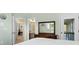 Bedroom view through doorway showing bed, dresser, and hallway to bathroom and entryway at 1 Battery Park Rd, Edisto Island, SC 29438