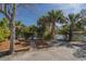 Beautifully landscaped grounds with mature palms, a fountain, and mulched beds with log borders at 1 Battery Park Rd, Edisto Island, SC 29438