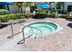 Inviting hot tub with seating around, promises a relaxing retreat amidst beautiful landscaping at 1 Battery Park Rd, Edisto Island, SC 29438