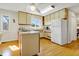 Well-lit kitchen with stainless steel appliances, ample counter space and wood floors at 1 Battery Park Rd, Edisto Island, SC 29438