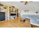 Spacious living room with hardwood floors, built-in bookshelves, and comfortable seating at 1 Battery Park Rd, Edisto Island, SC 29438