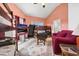 Upstairs room featuring a bunk bed, tv, red sofa and vaulted ceilings at 1 Battery Park Rd, Edisto Island, SC 29438