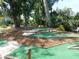 Scenic mini-golf course with lush landscaping, tiered greens, and a relaxing water feature at 1 Battery Park Rd, Edisto Island, SC 29438