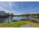 Beautiful waterfront view showing a body of water surrounded by lush greenery and neighborhood homes at 1 Battery Park Rd, Edisto Island, SC 29438