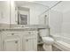 Bright bathroom with tub/shower, toilet, large mirror and vanity at 107 Lewisfield Dr, North Charleston, SC 29418