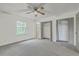 Bedroom with carpet, fan, window, and double-door closets at 107 Lewisfield Dr, North Charleston, SC 29418