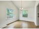 Dining room with chandelier, hardwood floors, and natural light at 107 Lewisfield Dr, North Charleston, SC 29418