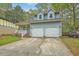 Charming two-story home with blue siding, double garage, and inviting front porch at 107 Lewisfield Dr, North Charleston, SC 29418