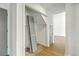 Hallway featuring an open closet, wood floors and door access to other rooms in the home at 107 Lewisfield Dr, North Charleston, SC 29418
