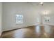 Bright living room with vaulted ceiling, hardwood floors, and ample natural light at 107 Lewisfield Dr, North Charleston, SC 29418
