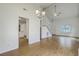 Bright living room featuring wood floors, a chandelier, stairs, and a large window offering lots of natural light at 107 Lewisfield Dr, North Charleston, SC 29418