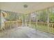 Open screened porch with natural light and yard views at 107 Lewisfield Dr, North Charleston, SC 29418