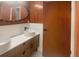 Modern bathroom featuring dual sinks, updated fixtures, and stylish wood accents at 1085 Russellville Rd, Saint Stephen, SC 29479