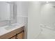 Bright bathroom with new vanity, mirror, and walk-in shower at 1085 Russellville Rd, Saint Stephen, SC 29479