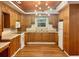 Spacious kitchen features wood cabinets, matching appliances, and modern lighting at 1085 Russellville Rd, Saint Stephen, SC 29479