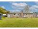 Brick home featuring a large backyard with mature trees and a privacy fence at 1109 Lee Shore Ln, Mount Pleasant, SC 29464